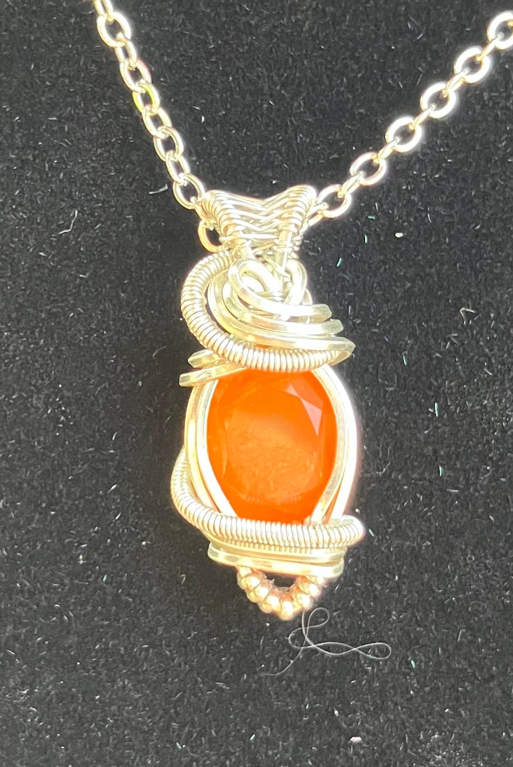 Faceted Carnelian Wire Wrapped Pendant in Silver Tone Copper
